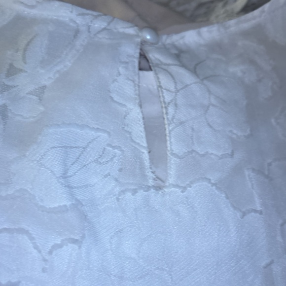 Zulily top in XXL has embossed flowers It’s  lining the sleeve are see-threw - Picture 10 of 15